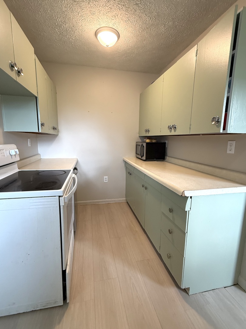 1305 Harper Drive Rantoul, IL 61866 - Photo 4 of 10 a utility room with sink dryer and washer