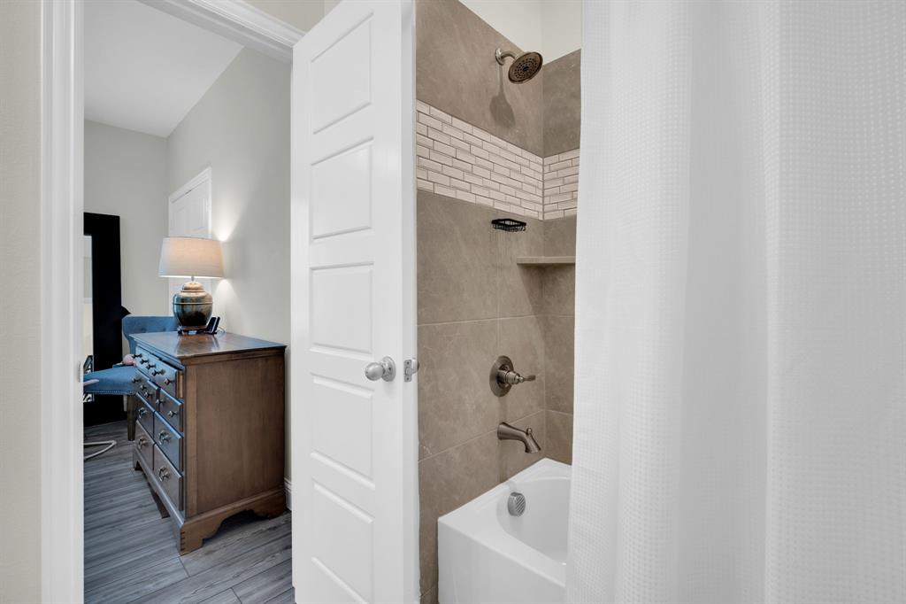 1601 Bear Path Way Gunter, TX 75058 - Photo 26 of 40 a bathroom with a bathtub and a sink