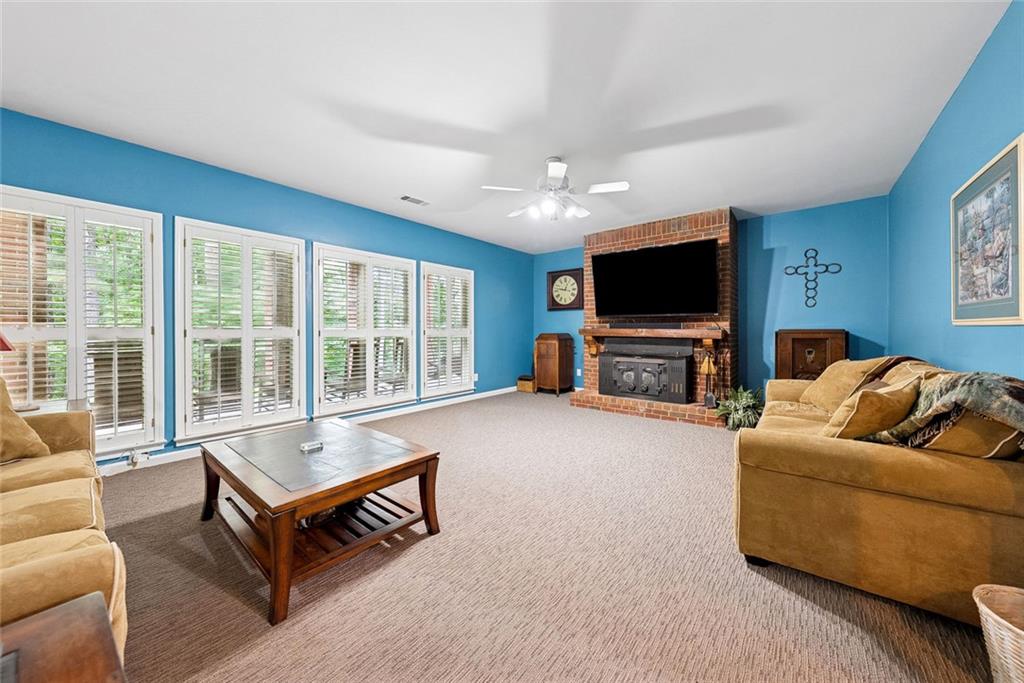 3309 Hamby Road Milton, GA 30004 - Photo 48 of 95 a living room with furniture and a flat screen tv