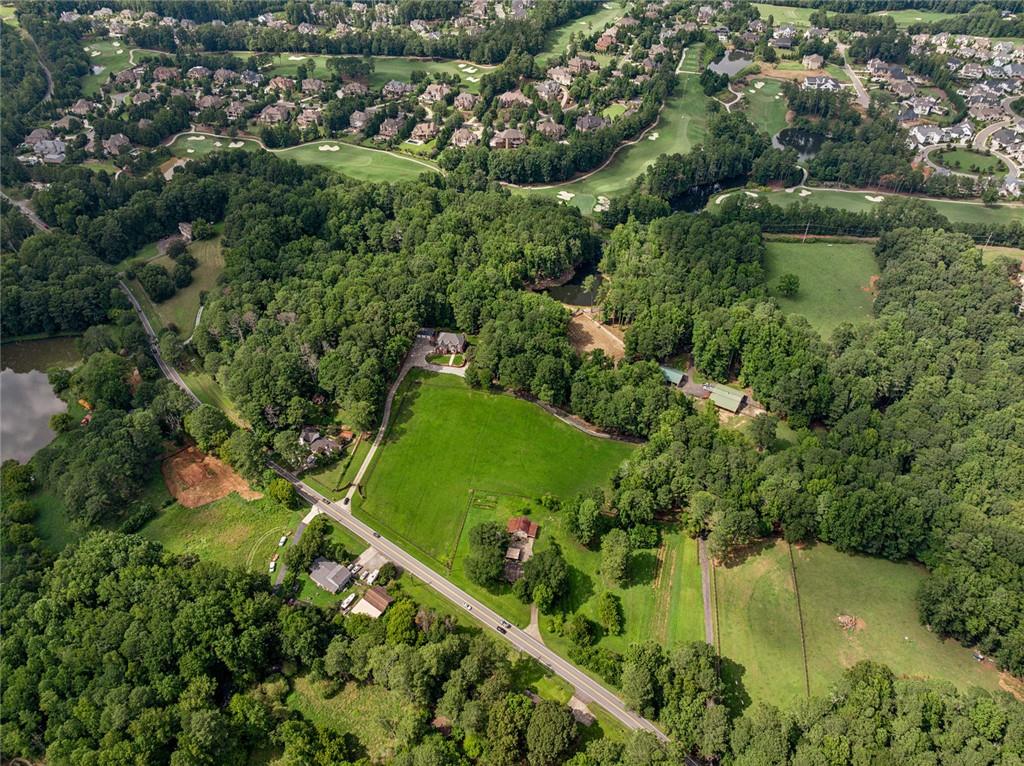 3309 Hamby Road Milton, GA 30004 - Photo 92 of 95 an aerial view of a residential houses with outdoor space and trees