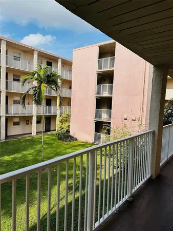 a view of a swimming pool with a yard