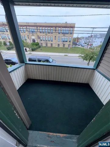 a view of balcony with a garden
