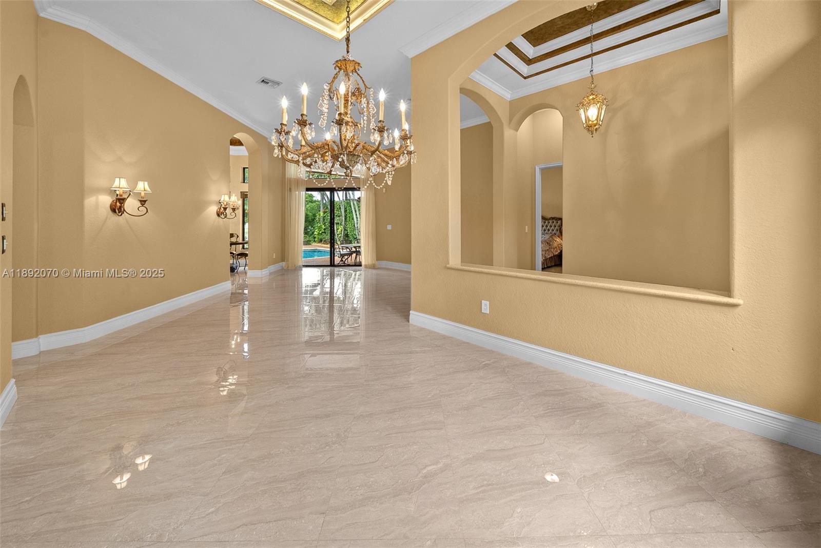 19230 Southwest 30th Street Miramar, FL 33029 - Photo 13 of 45 a view of a big room with chandelier and windows