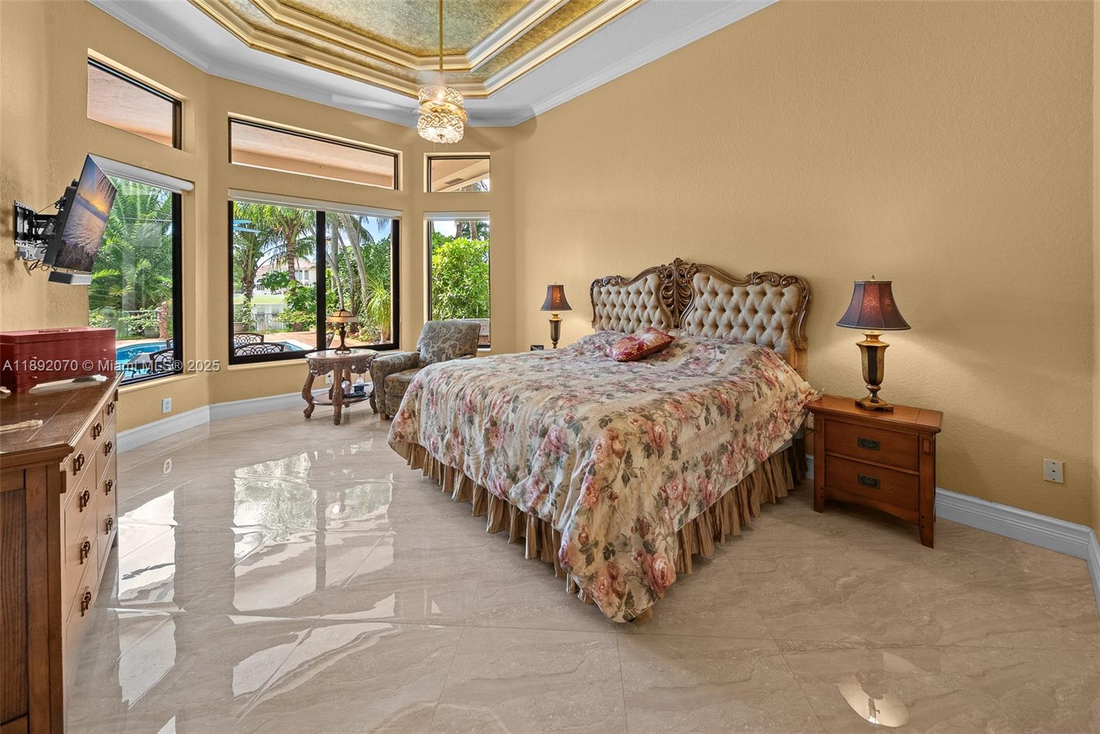 19230 Southwest 30th Street Miramar, FL 33029 - Photo 14 of 45 a bedroom with a bed and large windows