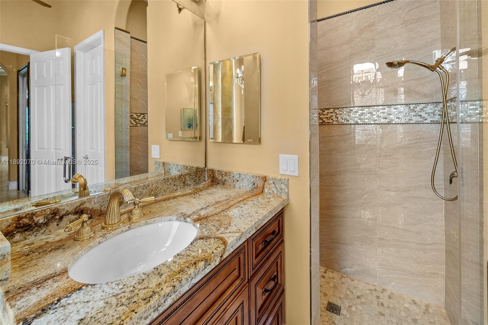 19230 Southwest 30th Street Miramar, FL 33029 - Photo 19 of 45 a bathroom with a granite countertop shower and a sink