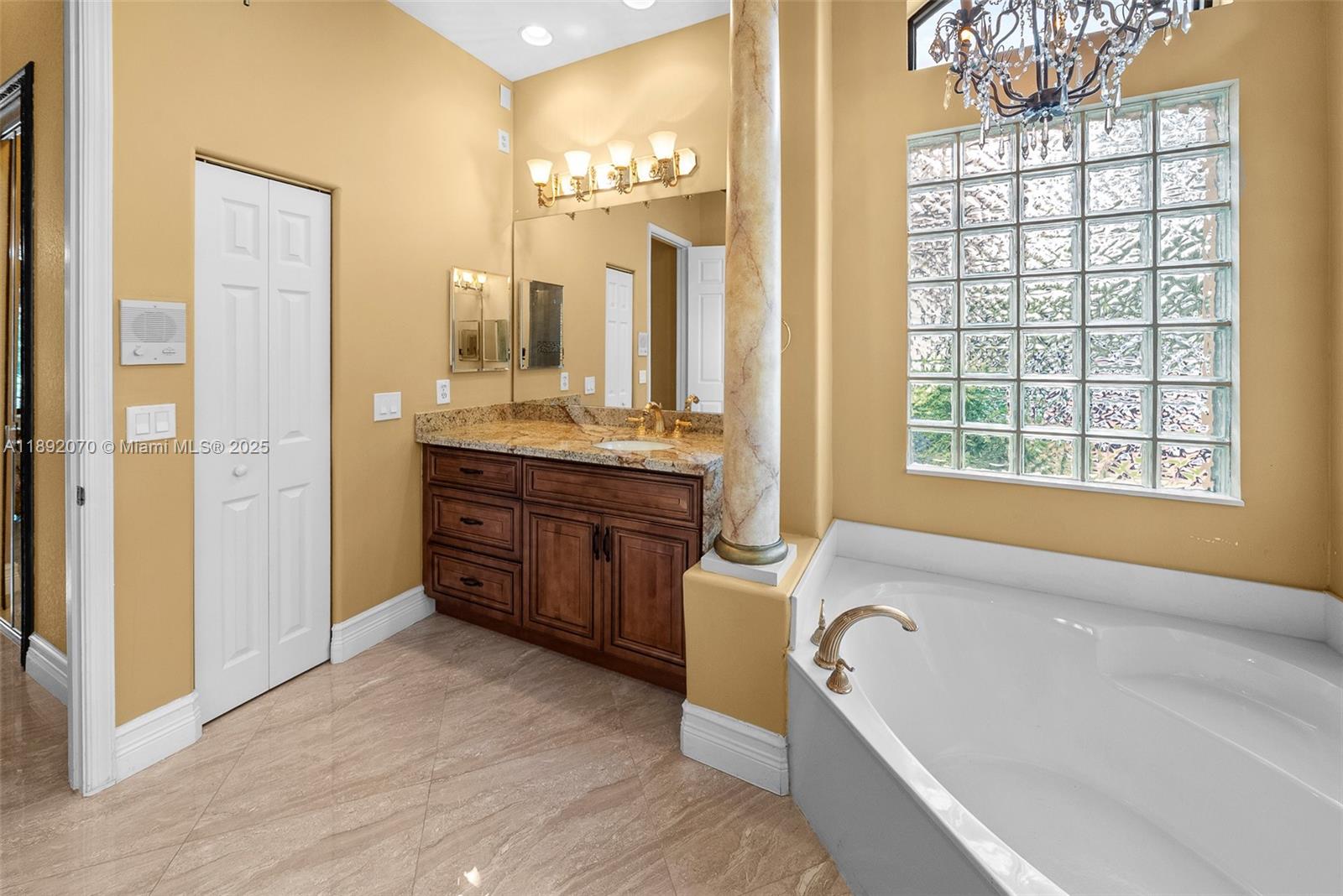 19230 Southwest 30th Street Miramar, FL 33029 - Photo 20 of 45 a spacious bathroom with a granite countertop tub sink and mirror