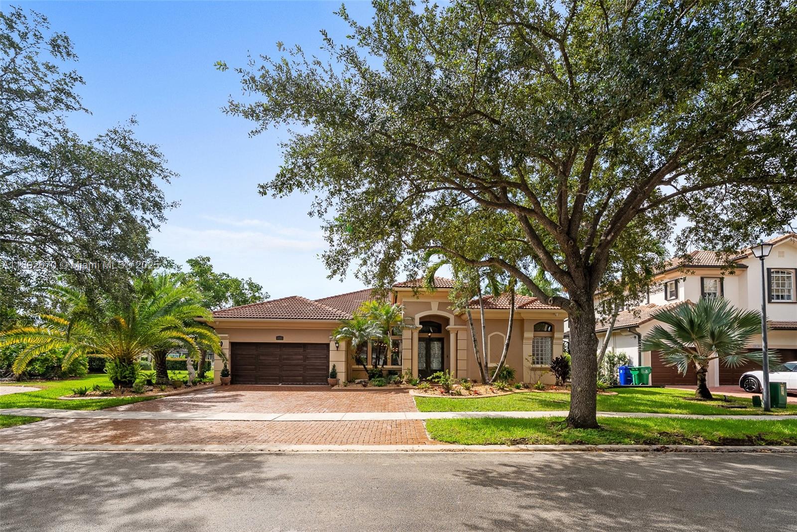 19230 Southwest 30th Street Miramar, FL 33029 - Photo 41 of 45 a front view of a house with a garden
