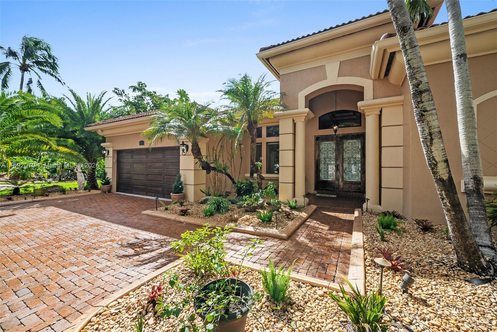 19230 Southwest 30th Street Miramar, FL 33029 - Photo 5 of 45 a front view of a house with garden
