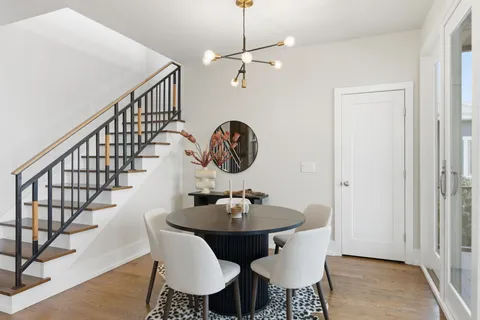 a view of a dining room with furniture window and wooden floor