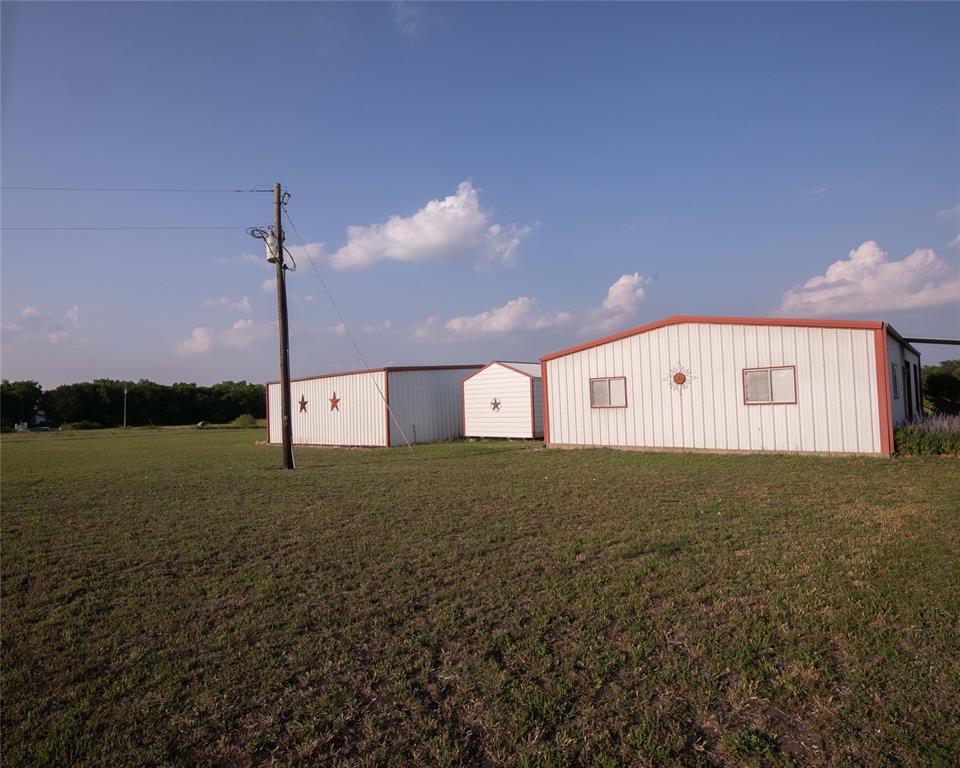 2424 Fm 3297 Ector, TX 75439 - Photo 36 of 38 West elevation of workshop, office and equipment barn