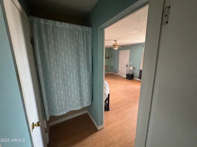 a kitchen with stainless steel appliances kitchen island granite countertop a refrigerator and a sink