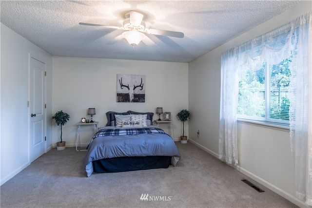 a white toilet sitting next to a bathroom sink