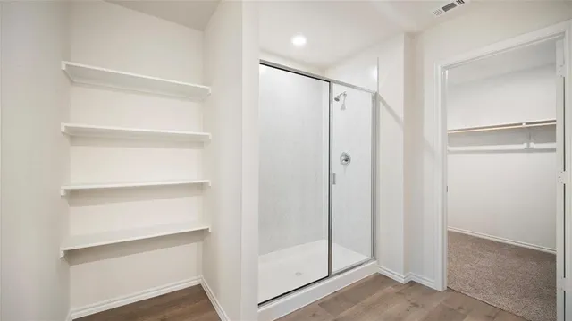 a view of an empty walk in closet