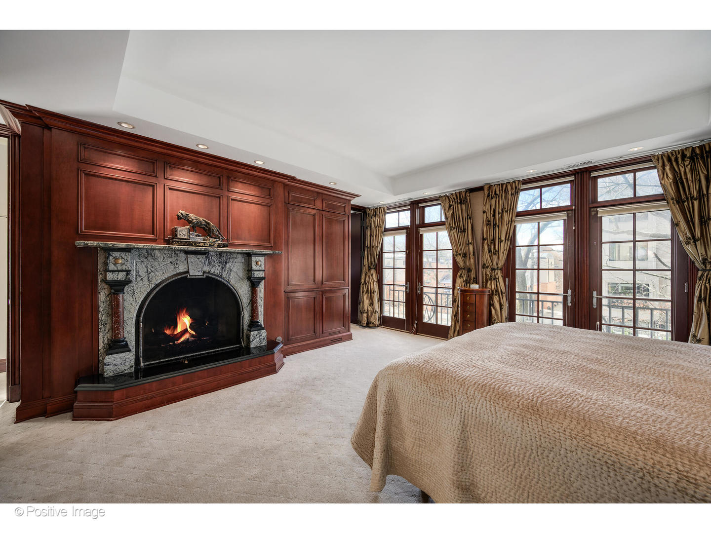 1811 North Howe Street Chicago, IL 60614 - Photo 26 of 42 a bedroom with a bed and a fireplace