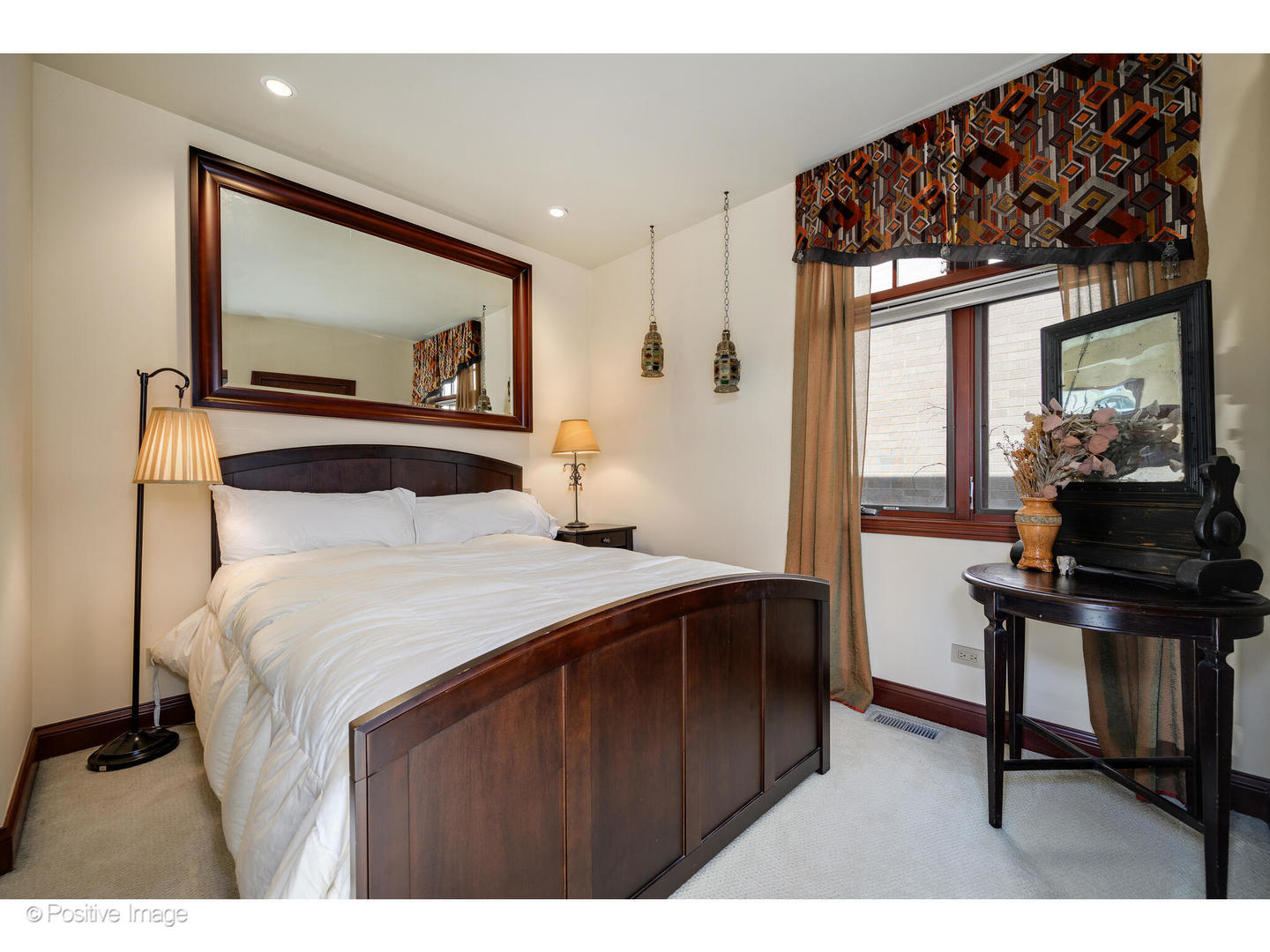 1811 North Howe Street Chicago, IL 60614 - Photo 39 of 42 a bedroom with a bed and a mirror