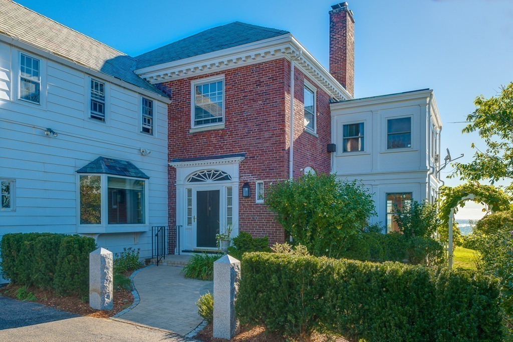 4 Coolidge Road Marblehead, MA 01945 - Photo 5 of 29 a front view of a house with a yard