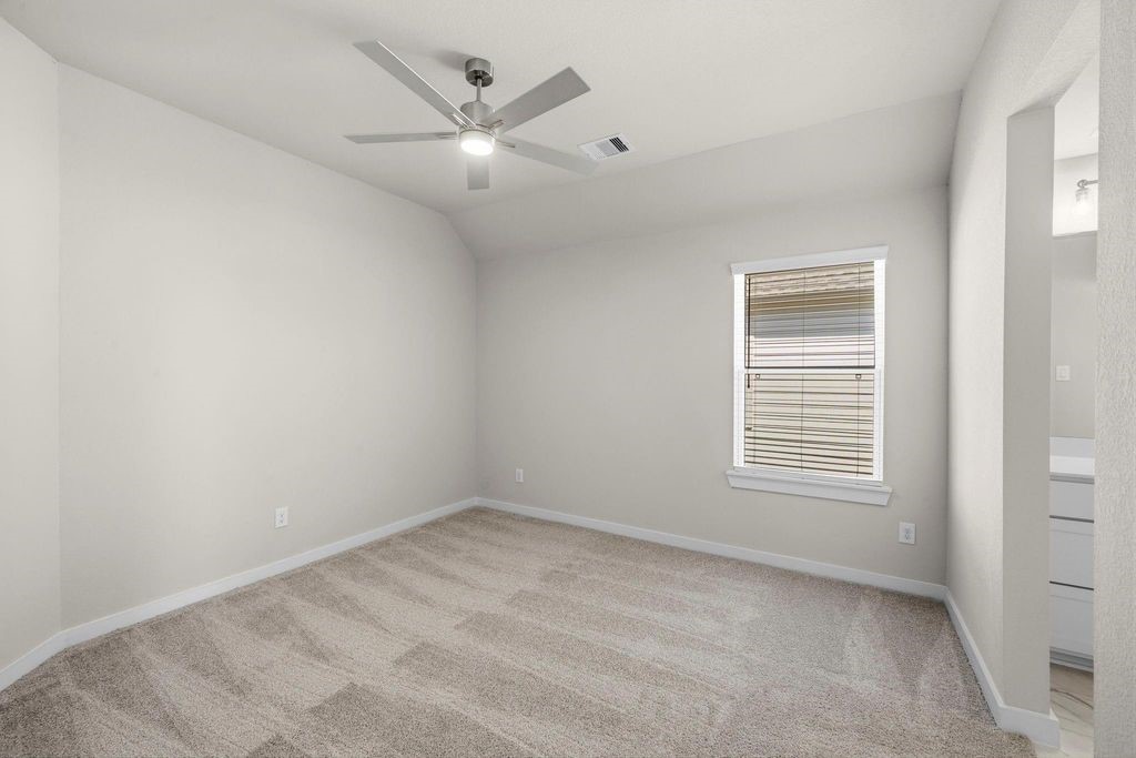 1972 Golden Spruce Lane Conroe, TX 77301 - Photo 18 of 19 an empty room with a window