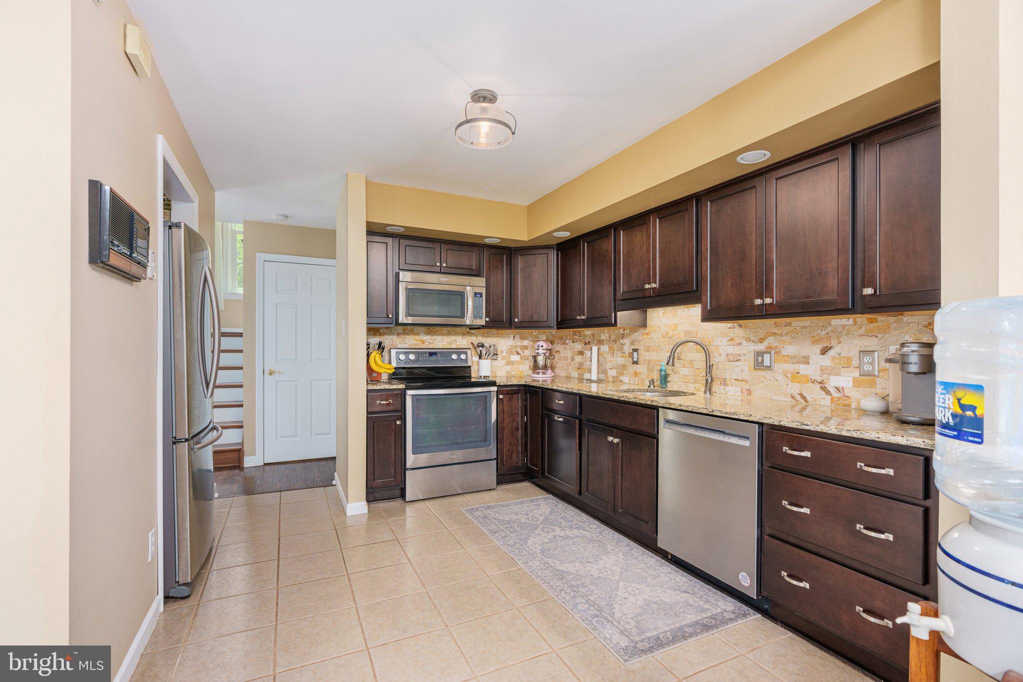 535 Richards Circle Pottstown, PA 19465 - Photo 11 of 44 a kitchen with stainless steel appliances granite countertop a refrigerator stove and sink