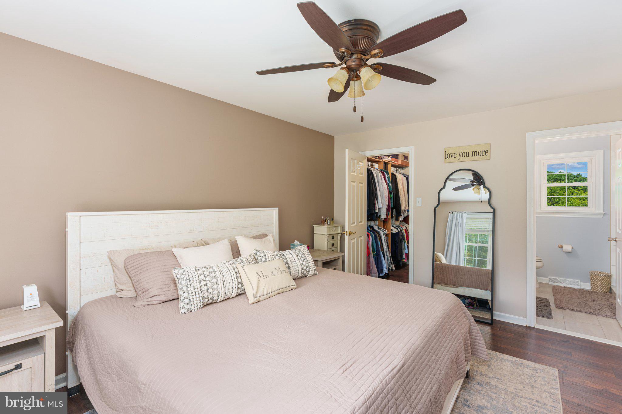 535 Richards Circle Pottstown, PA 19465 - Photo 22 of 44 a bedroom with a bed ceiling fan and a wooden floor