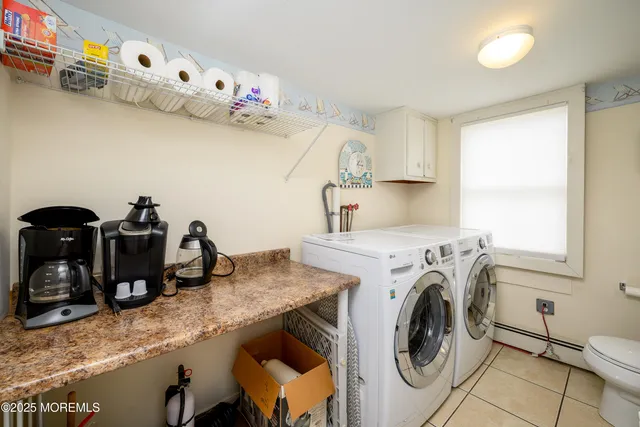 a bathroom with a toilet a sink and a mirror