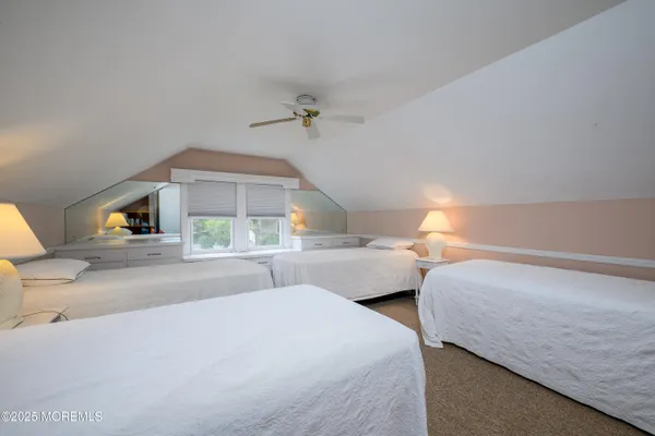 a bedroom with double bed and a window