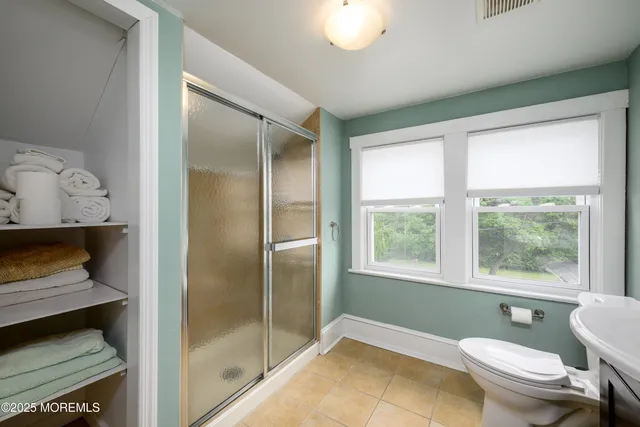 a room with furniture and pool table