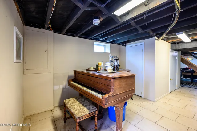 a view of patio with a table and chairs under an umbrella