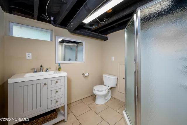 a view of patio with chairs and a table and chair under an umbrella