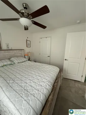 a bedroom with a bed and a dresser