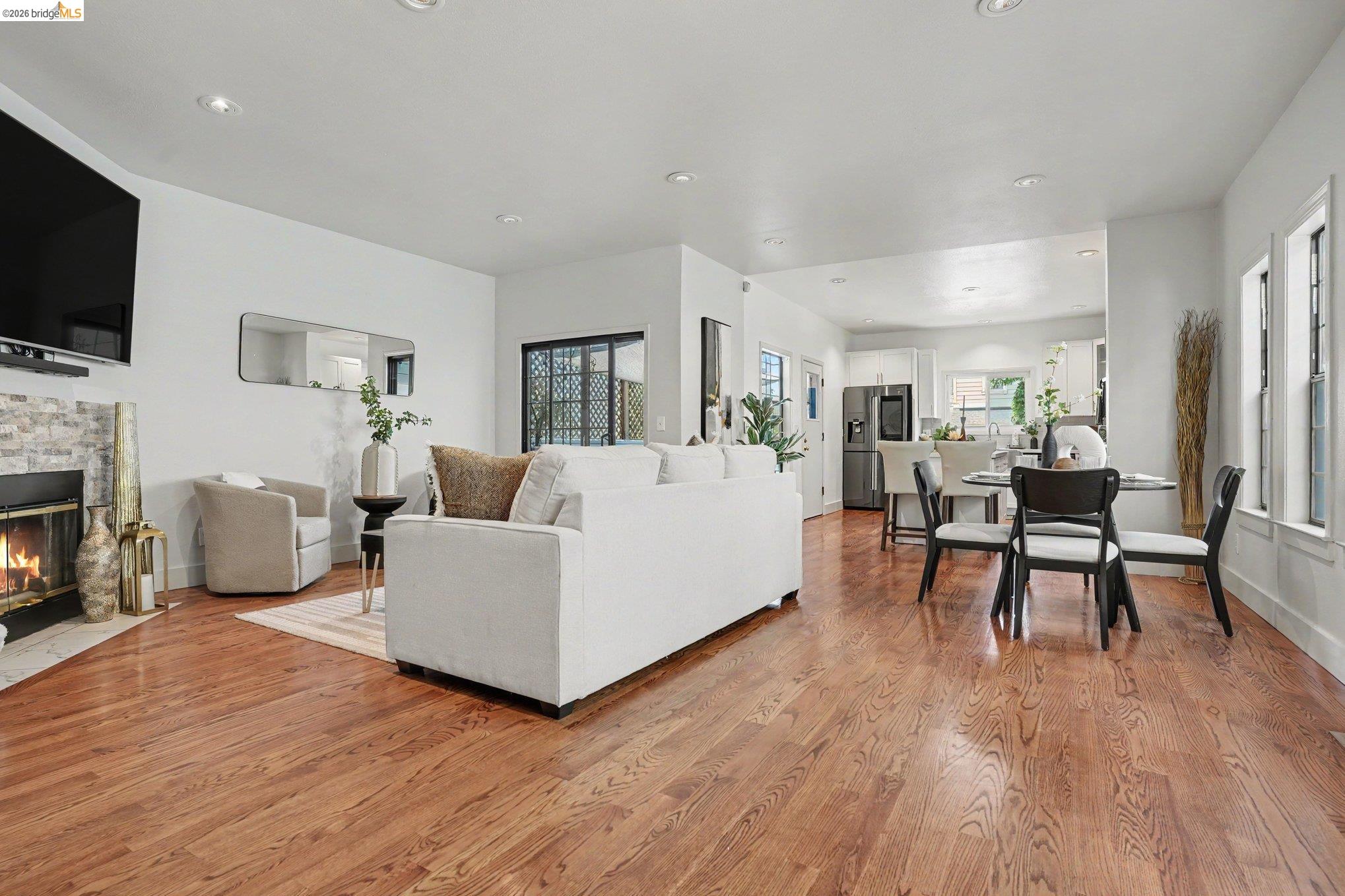 1433 Myrtle Street Oakland, CA 94607 - Photo 2 of 25 Open-concept living area featuring rich wood-finish flooring throughout