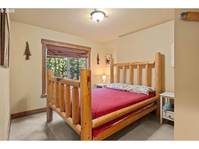 a bed room with a bed and a window