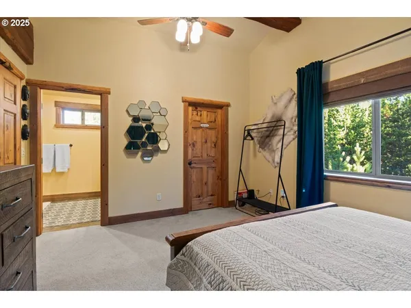 a bed room with a bed and a window