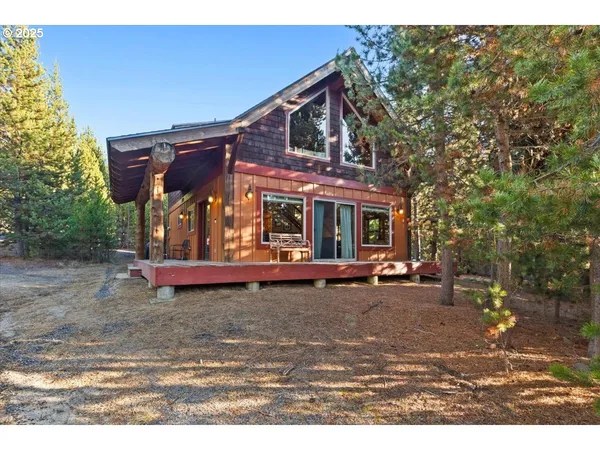 a view of a house with a yard patio and sitting area