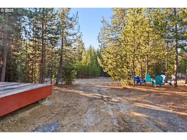 a backyard of a house with large trees