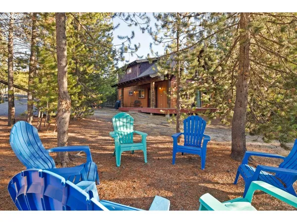 a view of a chairs and table in the patio