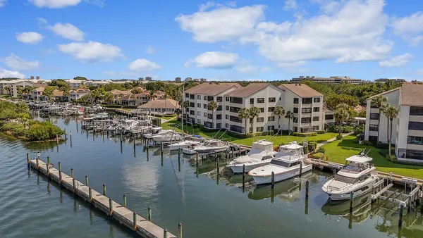 a view of a lake with couches and city view