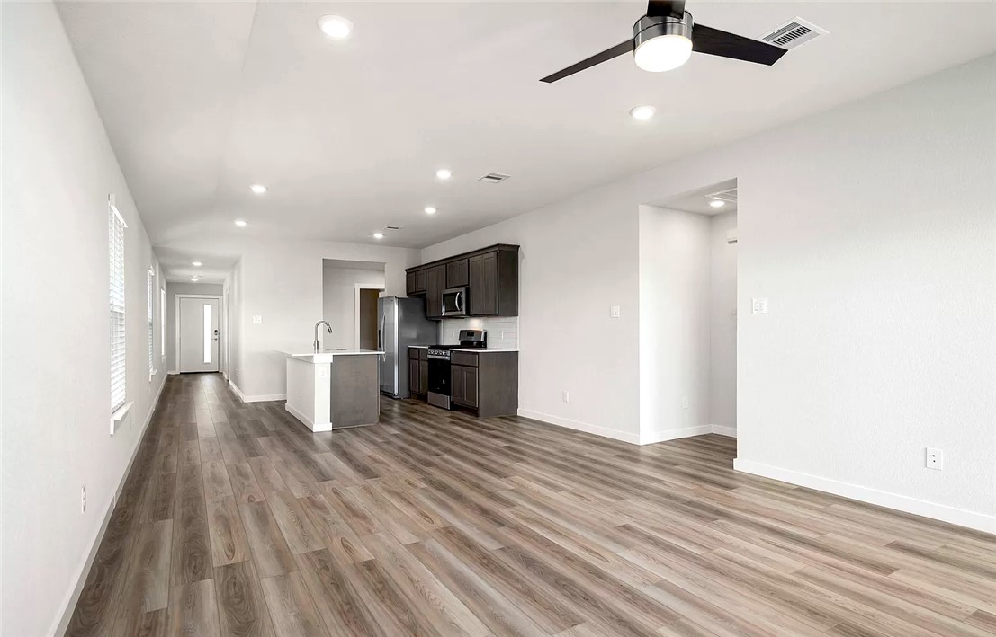 925 Kickapoo Lane College Station, TX 77845 - Photo 7 of 20 a view of kitchen with refrigerator microwave and stove