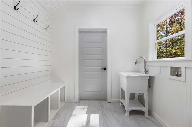 a view of a room with wooden walls