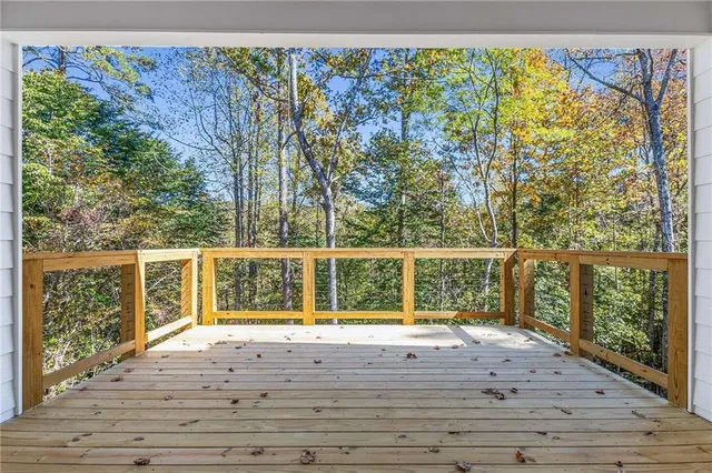 an aerial view of house with yard and mountain view in back