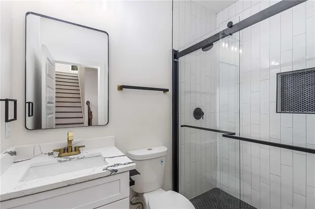 a kitchen with granite countertop a stove and cabinets