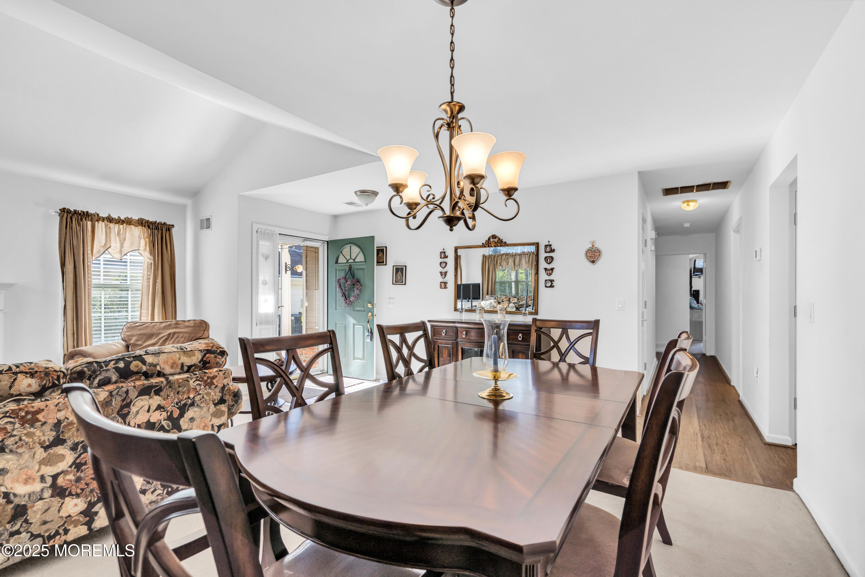 14 Pine Valley Road Lakewood, NJ 08701 - Photo 12 of 56 a view of a dining room with furniture a chandelier and wooden floor