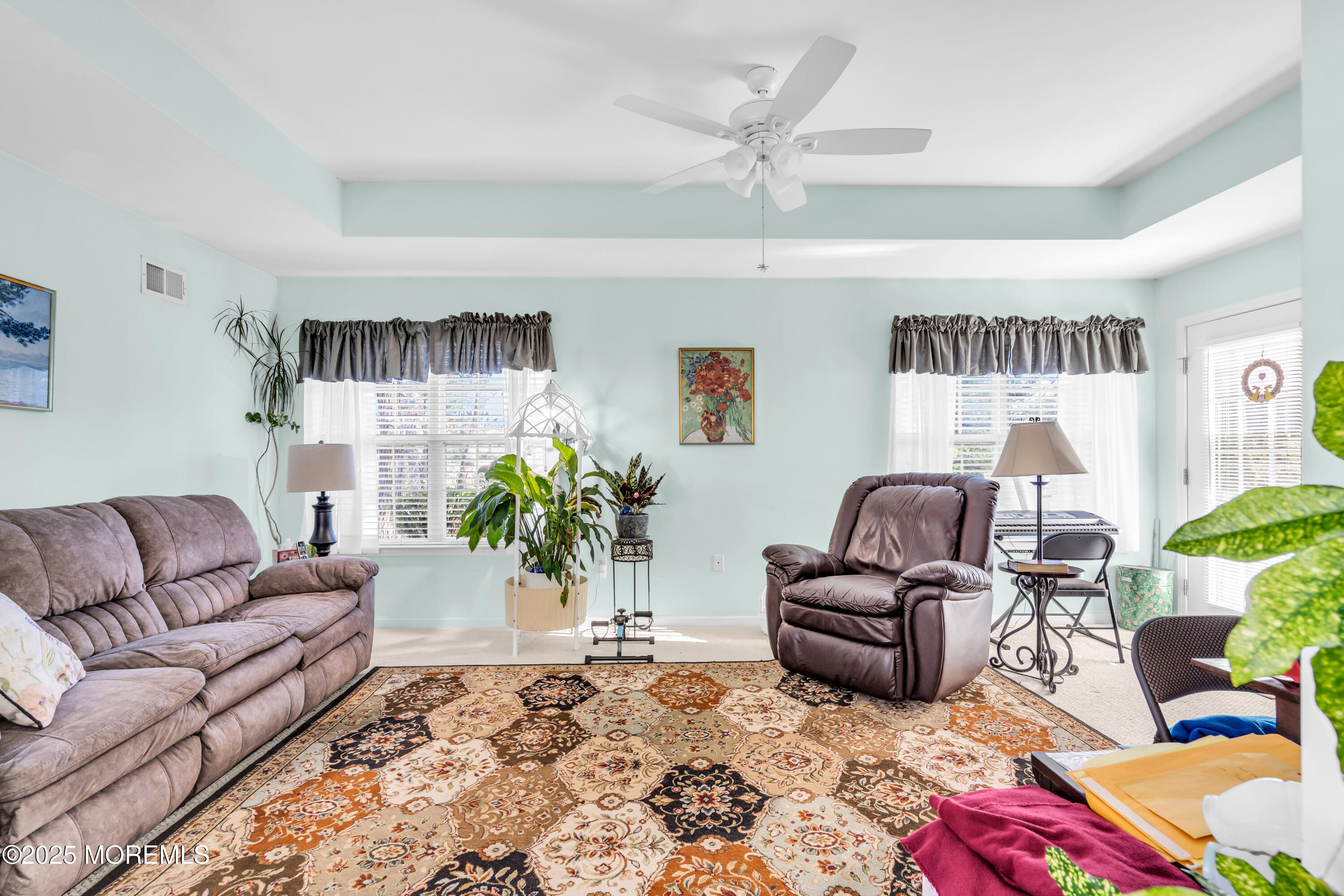 14 Pine Valley Road Lakewood, NJ 08701 - Photo 17 of 56 a living room with furniture ceiling fan and a rug