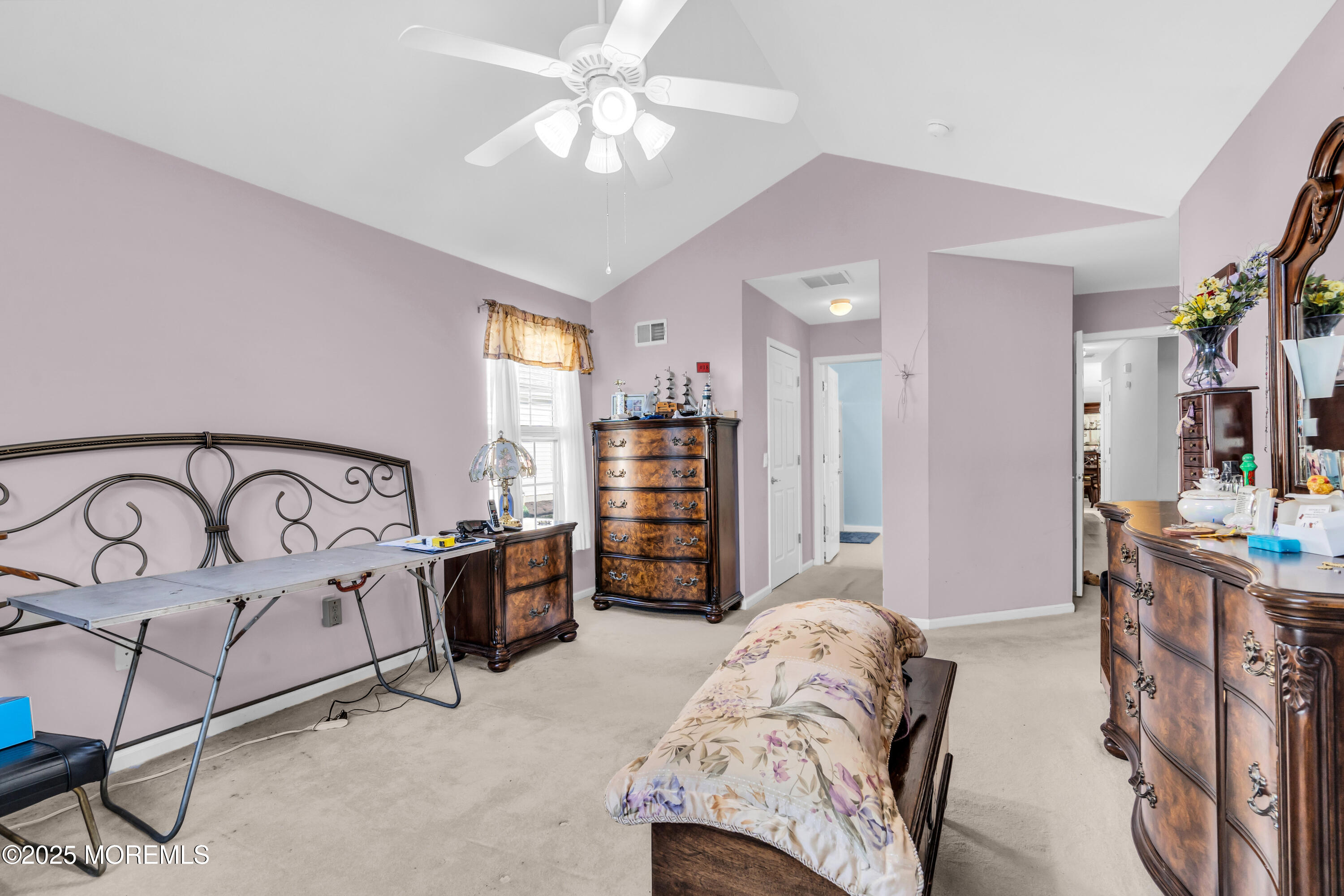 14 Pine Valley Road Lakewood, NJ 08701 - Photo 21 of 56 a bedroom with furniture and a chandelier