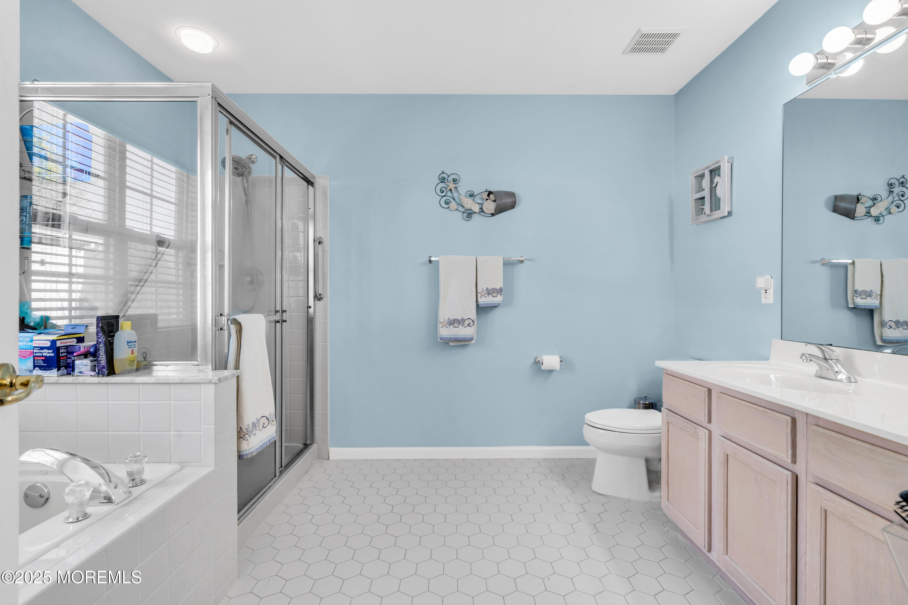 14 Pine Valley Road Lakewood, NJ 08701 - Photo 22 of 56 a bathroom with a sink a toilet and a mirror