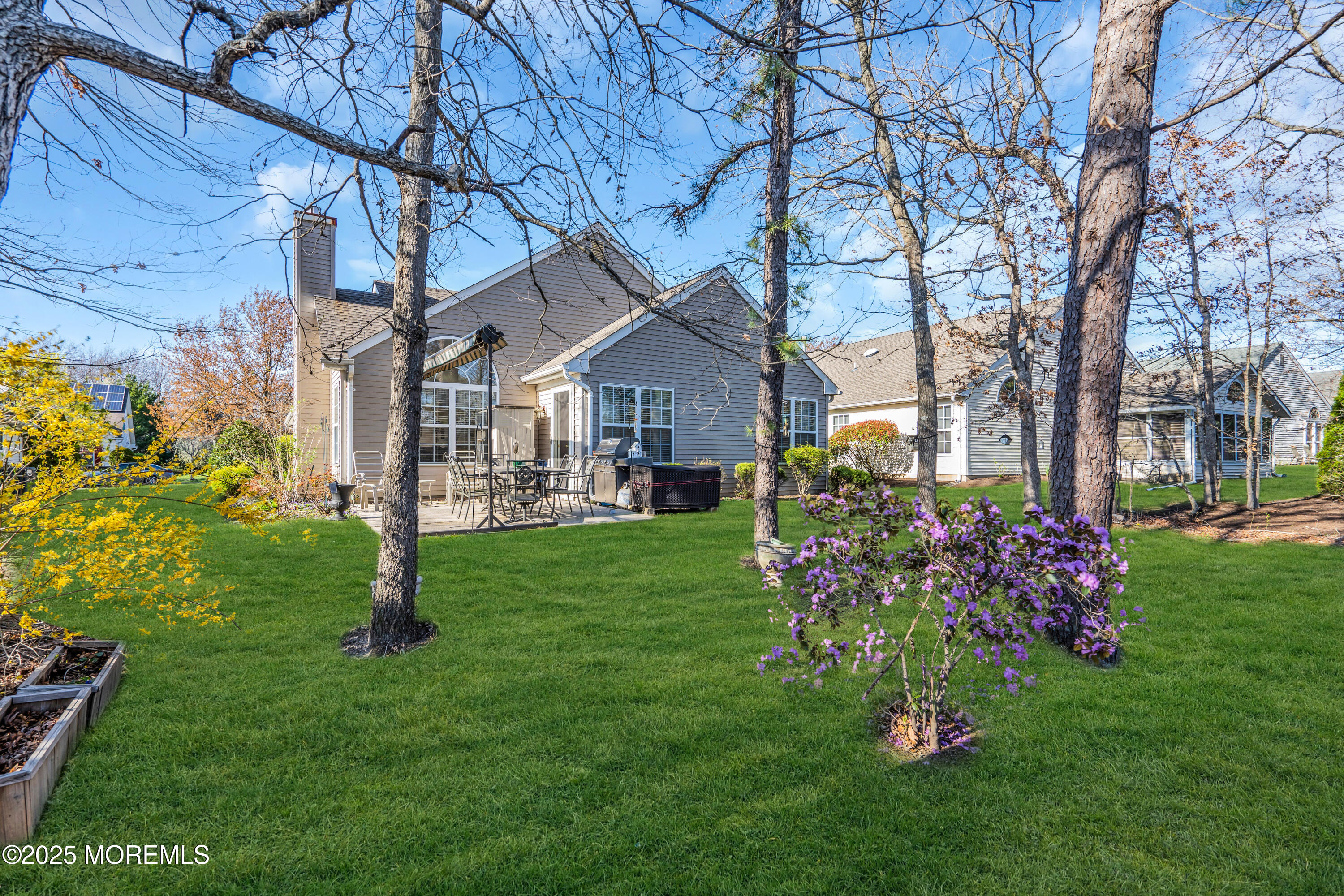 14 Pine Valley Road Lakewood, NJ 08701 - Photo 25 of 56 a front view of a house with a garden