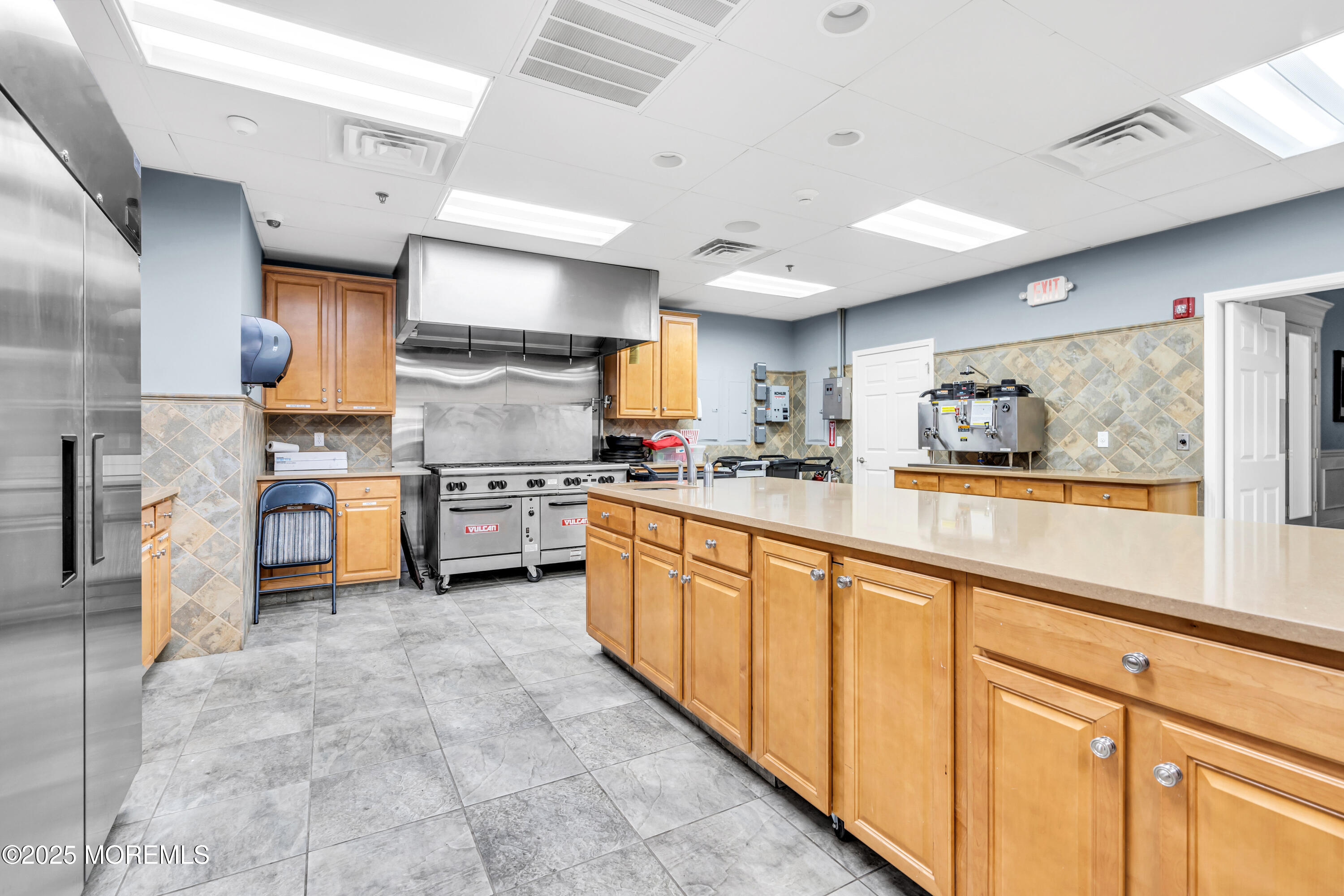 14 Pine Valley Road Lakewood, NJ 08701 - Photo 32 of 56 a kitchen with stainless steel appliances granite countertop a stove and a sink