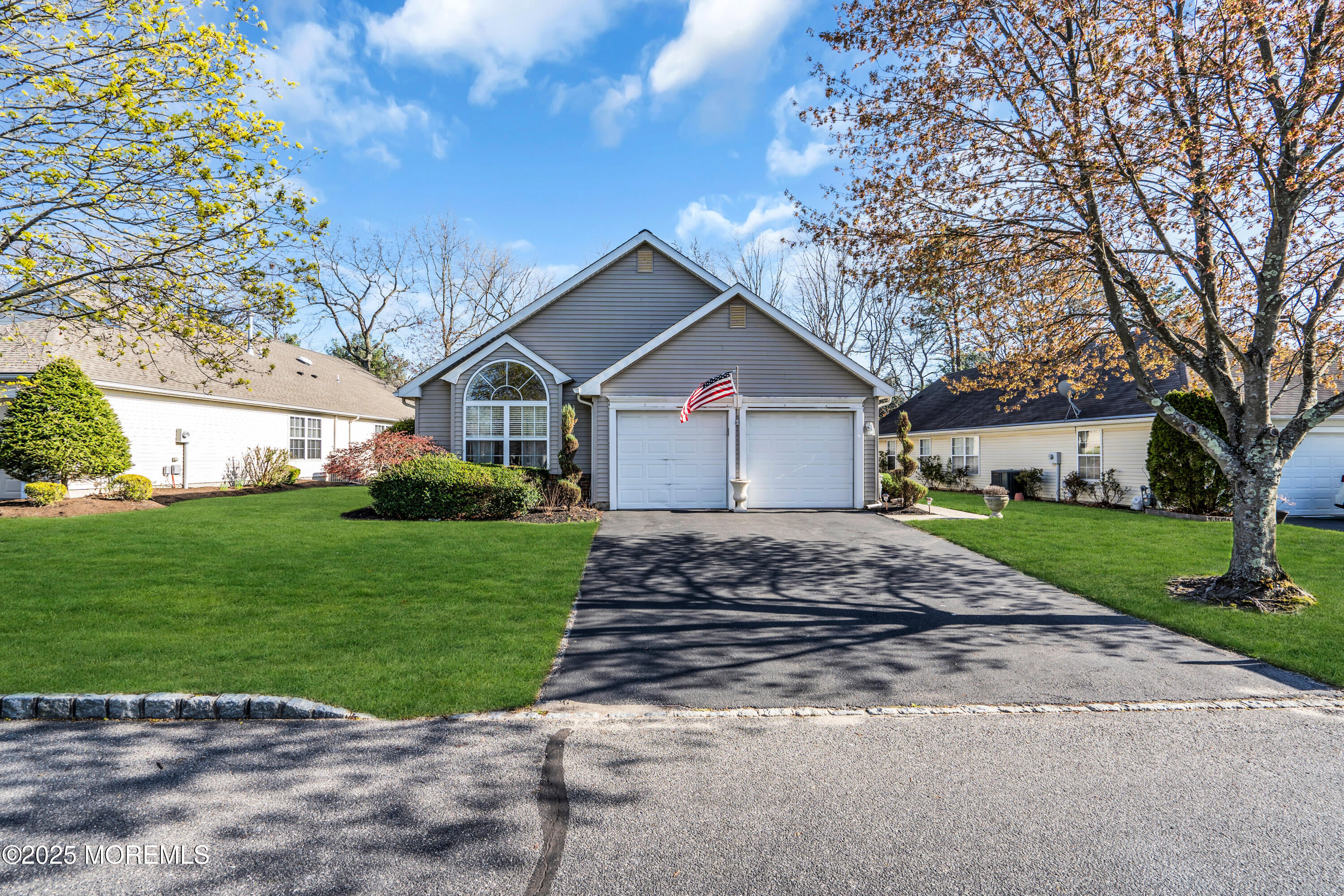 14 Pine Valley Road Lakewood, NJ 08701 - Photo 4 of 56 a front view of a house with a yard