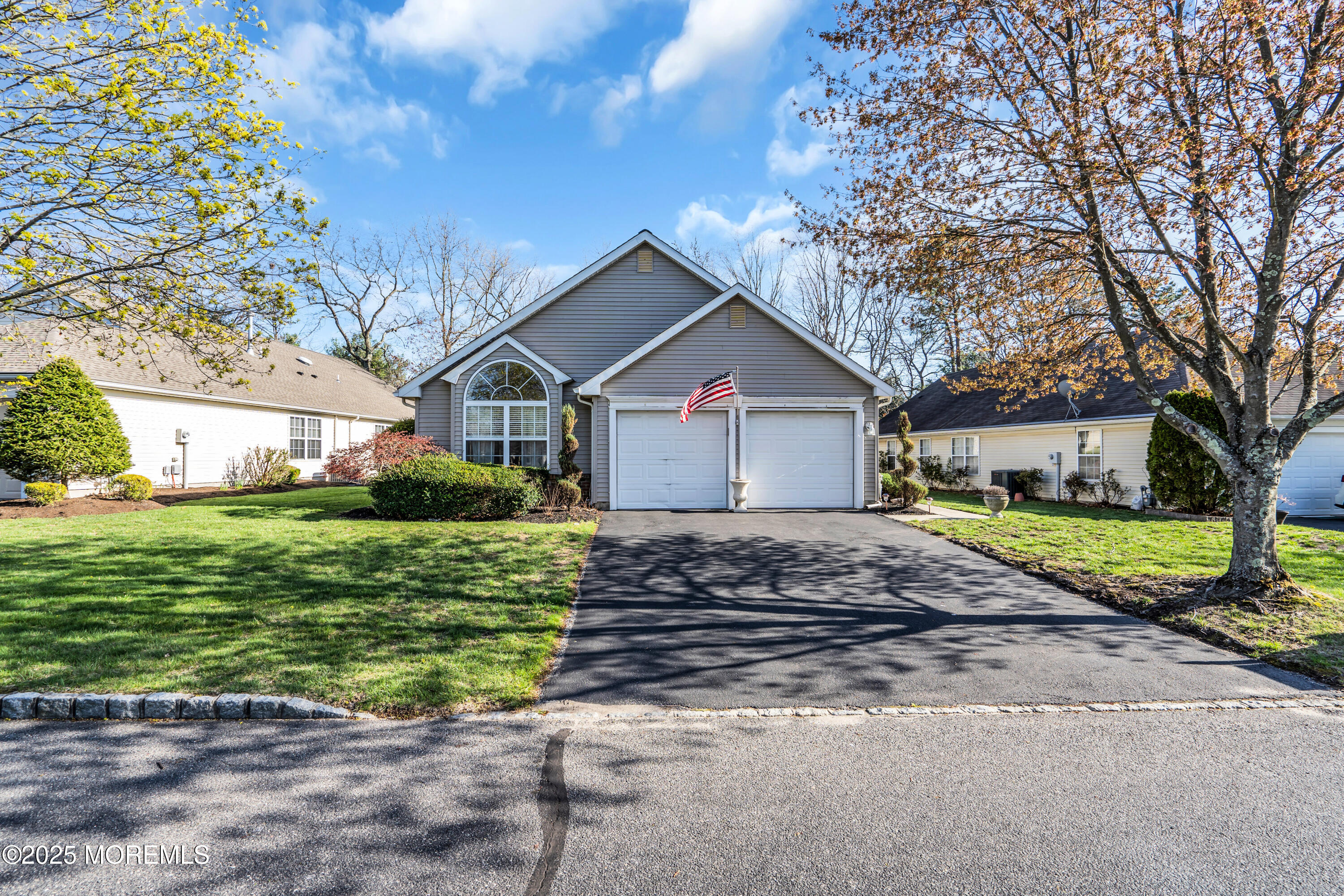 14 Pine Valley Road Lakewood, NJ 08701 - Photo 51 of 56 a front view of a house with a garden
