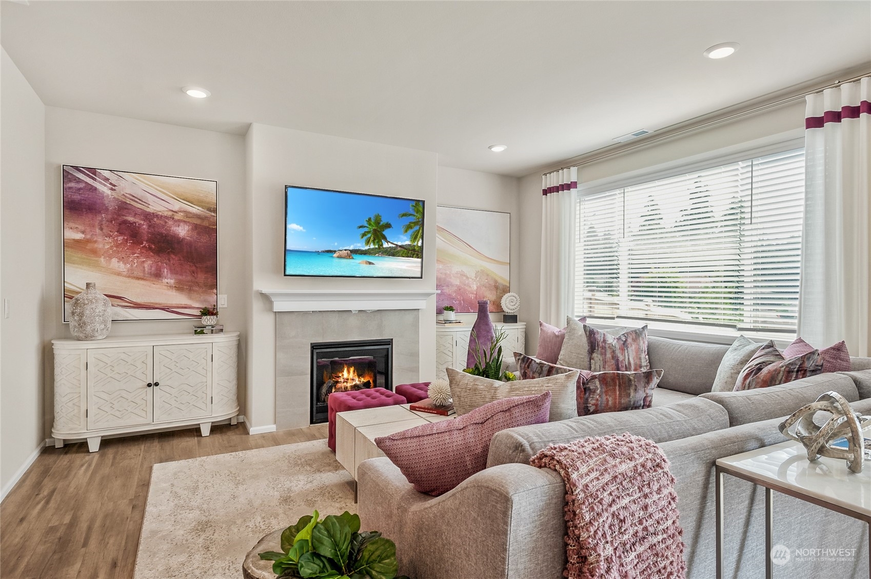 131 179th Street Southeast, Unit 3 Bothell, WA 98012 - Photo 4 of 16 a living room with furniture a flat screen tv and a fireplace