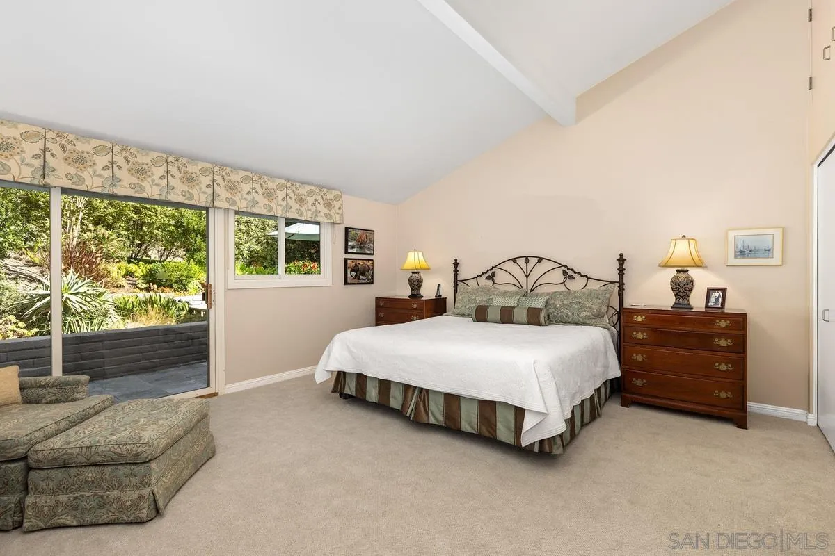 5625 Caminito Isla La Jolla, CA 92037 - Photo 11 of 29 a bedroom with a bed lamp and window